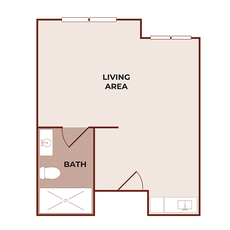 A simple studio apartment floor plan showing a large living area, a separate bathroom with a toilet and shower, and a small kitchenette along one wall. There are two windows in the living area.