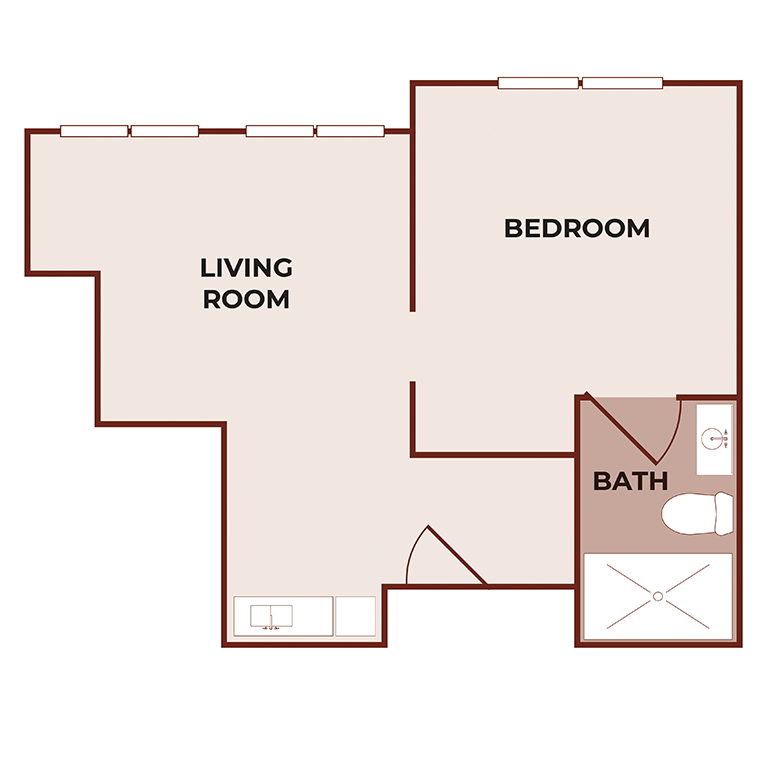 Floor plan of a one-bedroom apartment showing a living room, bedroom, bathroom with shower and toilet, and a small kitchen area along the living room wall. Labels indicate each room.